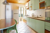 A kitchen or kitchenette at Duplex sul porto grande by Wonderful Italy
