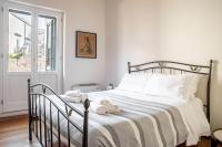 A bed or beds in a room at Duplex sul porto grande by Wonderful Italy
