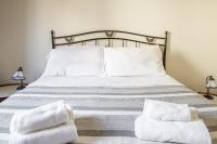 A bed or beds in a room at Duplex sul porto grande by Wonderful Italy