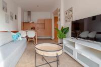 Televízia a/alebo spoločenská miestnosť v ubytovaní Apartamento 303 junto a la playa piscina y parking