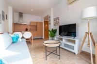 Televízia a/alebo spoločenská miestnosť v ubytovaní Apartamento 303 junto a la playa piscina y parking