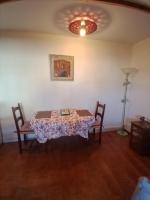 a dining room with a table and two chairs at Gîte Chez Dado &amp; Denis Saint Martin d&#39;Ardèche in Saint-Martin-dʼArdèche