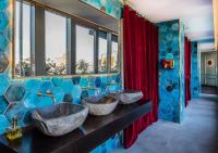 a bathroom with two sinks in a room with windows at Axel Hotel Barcelona - Adults Only in Barcelona