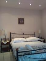 Posteľ alebo postele v izbe v ubytovaní Akrata Rose Garden Apartments I