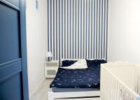 Posteľ alebo postele v izbe v ubytovaní Aura Apartament