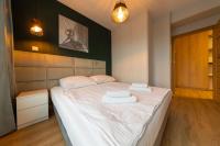 Łóżko lub łóżka w pokoju w obiekcie Apartament Luxury Two-bedroom