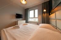 Łóżko lub łóżka w pokoju w obiekcie Apartament Luxury Two-bedroom
