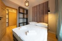 Łóżko lub łóżka w pokoju w obiekcie Apartament Luxury Two-bedroom