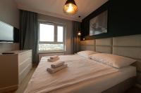 Łóżko lub łóżka w pokoju w obiekcie Apartament Luxury Two-bedroom
