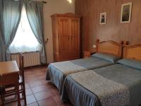 Postel nebo postele na pokoji v ubytování Casa Rural IRIS
