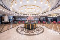 a large ballroom with a large chandelier and a large lobby at Lake River Side Hotel Spa in Side
