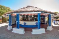 a small food cart with a thatched roof at Bungalows Tangana in Tarifa