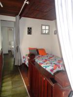 a bedroom with a bed in a room at Casa com Piscina Paraty in Paraty