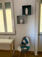 Televízia a/alebo spoločenská miestnosť v ubytovaní Terre d’Aci Apartments casa Peppe