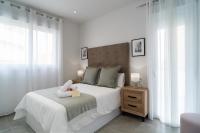 Postel nebo postele na pokoji v ubytování AAC Málaga - Apartamento con terraza, muy amplio, totalmente equipado, cerca del centro y nuevo!