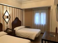 Posteľ alebo postele v izbe v ubytovaní Hostal La Mexicana