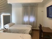 Posteľ alebo postele v izbe v ubytovaní Hostal La Mexicana