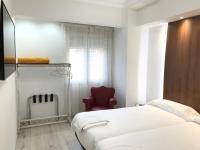 Posteľ alebo postele v izbe v ubytovaní Hostal La Mexicana