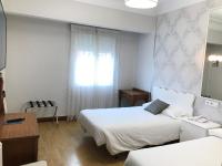 Posteľ alebo postele v izbe v ubytovaní Hostal La Mexicana
