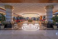 a lobby of a hotel with a chandelier at Lake River Side Hotel Spa in Side