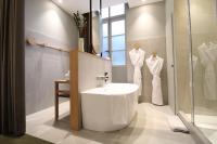 a bathroom with a white sink and a shower at MiHotel Sala in Lyon