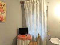 TV a/nebo společenská místnost v ubytování Hostal Albero by gaiarooms