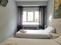 Postel nebo postele na pokoji v ubytování Hostal Albero by gaiarooms