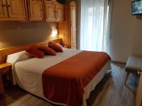 Postel nebo postele na pokoji v ubytování Hotel Sant Roc
