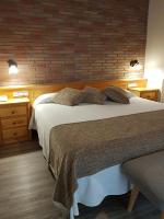 Postel nebo postele na pokoji v ubytování Hotel Sant Roc
