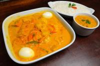 a bowl of soup and a bowl of rice on a table at Carnaubinha Praia Resort in Luis Correia