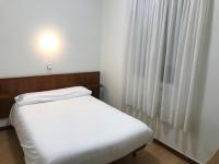 Posteľ alebo postele v izbe v ubytovaní Hostal La Mexicana