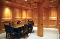 a dining room with a wooden table and chairs at Kandahar Lodge at Whitefish Mountain Resort in Whitefish