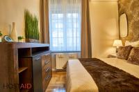 A bed or beds in a room at R7 Design Apartment - hostAID