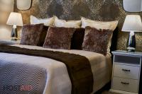 A bed or beds in a room at R7 Design Apartment - hostAID