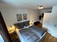 A bed or beds in a room at Citybergblick2