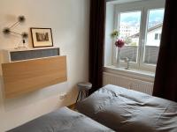 A bed or beds in a room at Citybergblick2