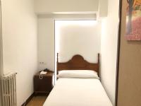 Posteľ alebo postele v izbe v ubytovaní Hostal La Mexicana
