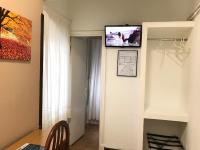 Televízia a/alebo spoločenská miestnosť v ubytovaní Hostal La Mexicana