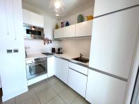 Een keuken of kitchenette bij L&#39;appartement Royal Palm
