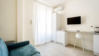 Telewizja i/lub zestaw kina domowego w obiekcie Italianway - The B Village Business