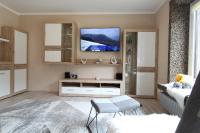 Televízia a/alebo spoločenská miestnosť v ubytovaní FABIAN - Ski und Thermen Appartement