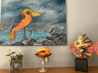 a painting of a bird on a wall at Hotel Diamant in Wedel