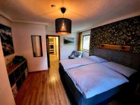 A bed or beds in a room at Haus Peter