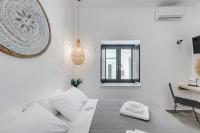 Posteľ alebo postele v izbe v ubytovaní SyRose Suites