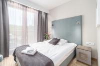 Łóżko lub łóżka w pokoju w obiekcie SeaPark Hotel Wellness & Spa