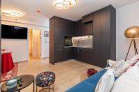 Televízia a/alebo spoločenská miestnosť v ubytovaní Perfect Downtown Apartment A217