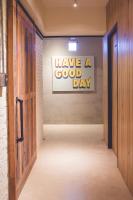 a hallway with a sign that says have a good day at Ahiruyah Guesthouse in Kaohsiung