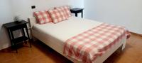 A bed or beds in a room at Comfy 2 Bedroom Apartment in Arguineguin with WiFi and Free Parking