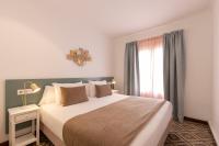 Posteľ alebo postele v izbe v ubytovaní Villa Ca na Tonina - La Goleta Hotel de Mar & Villas