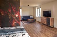 TV a/nebo společenská místnost v ubytování Urtica apartmány
